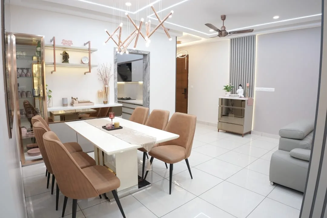 Dining area with sculptural pendant light and crockery unit